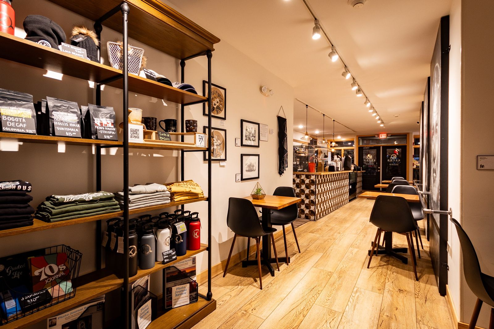 Coffee bag shelves and tables inside Krema Coffee Roasters Lockport