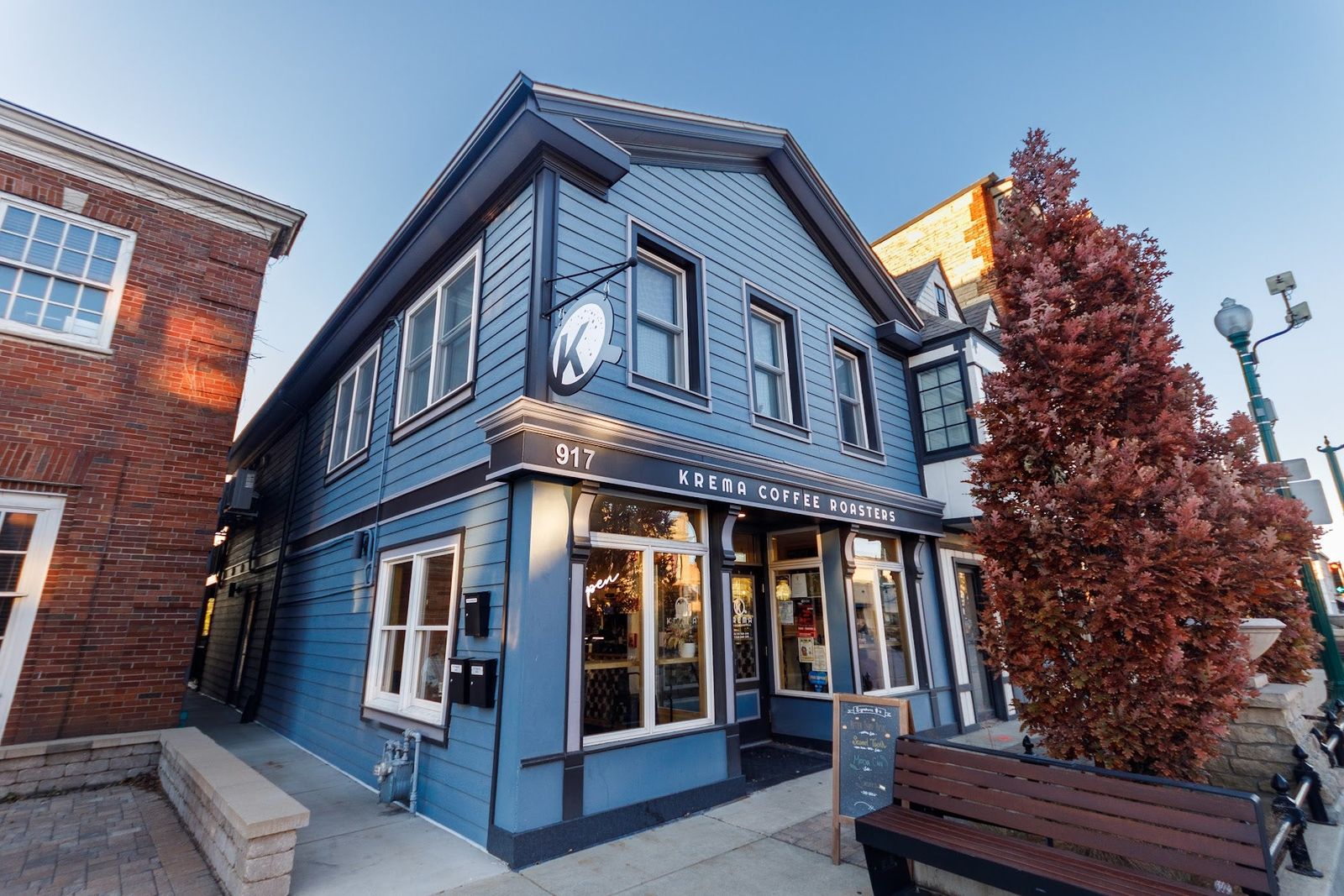 Krema Coffee Roasters in a blue corner building on State Street in Lockport