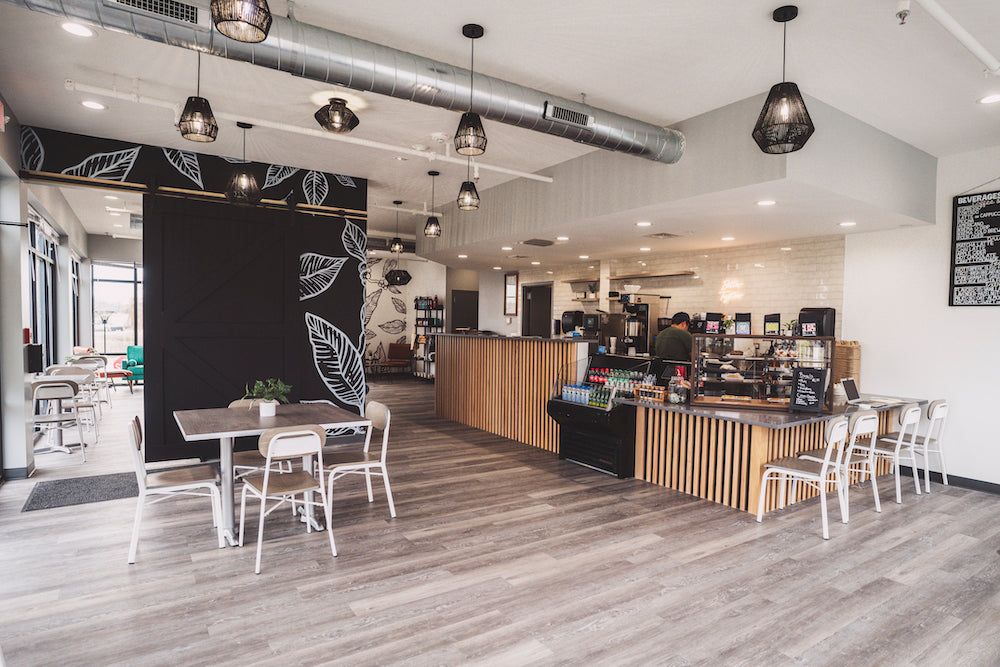 Bright counter and tables inside Krema Coffee Roasters North Aurora