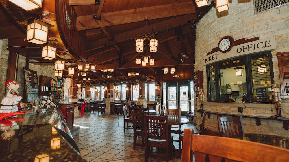 Wood beams and lantern lights inside Krema Coffee Roasters Tinley Park